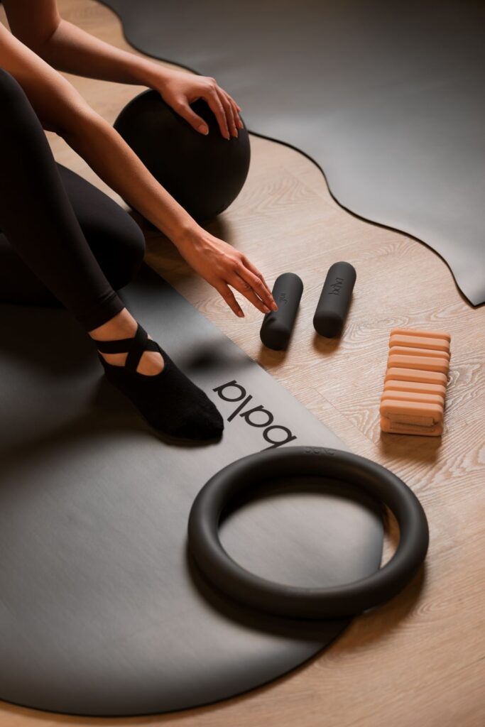 Woman using Pilates ring and props at Pure Motion Dubai